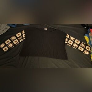 Women’s Pink Lily pullover black sweater with crochet granny square sleeves